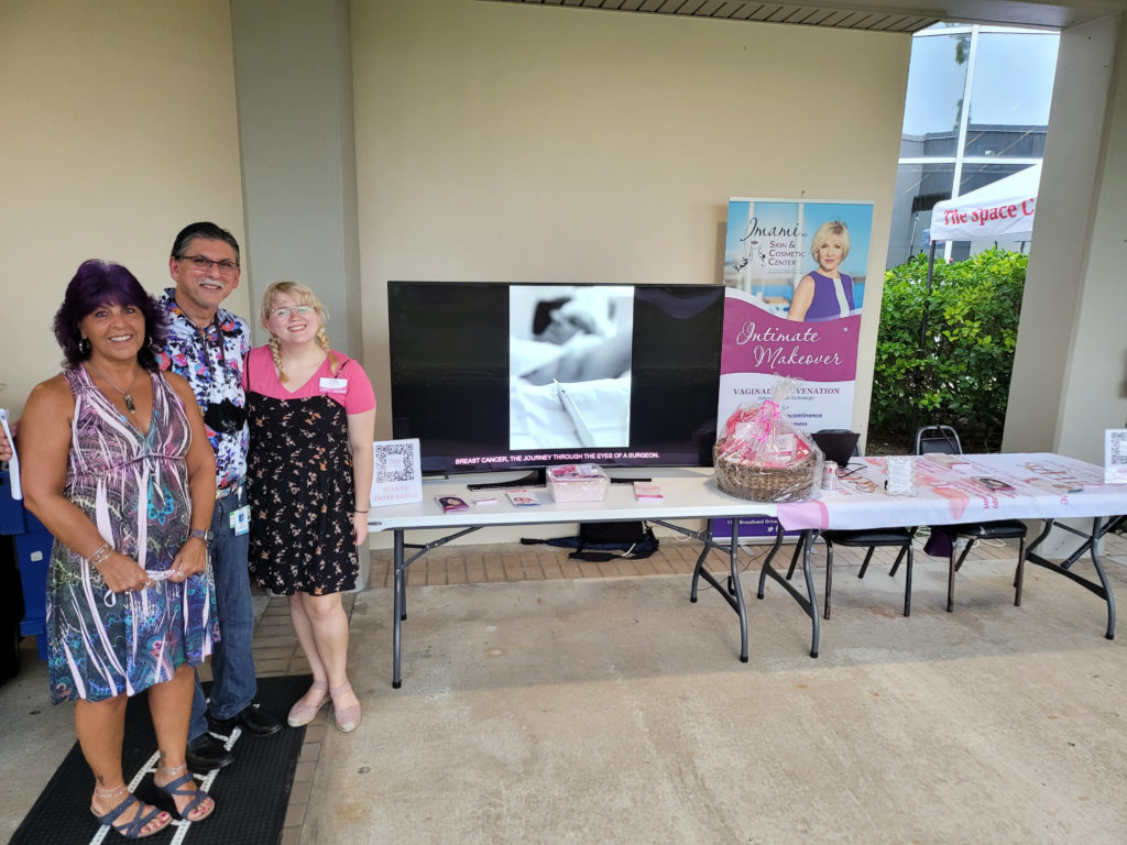 Photo of Dr. Imami, Olivia Magee, and Camille Caglianone at the King Center booth.