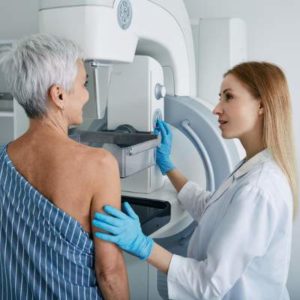 older woman getting a mammogram