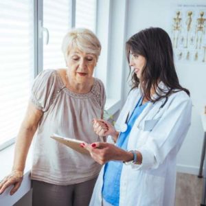 older woman talking to a doctor 